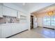 Bright kitchen with ample cabinetry and adjacent laundry area, creating a practical and efficient home space at 4154 57Th N St # 173, Kenneth City, FL 33709