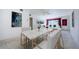 Inviting living room featuring a marble dining table, white furnishings, and stylish decor at 4154 57Th N St # 173, Kenneth City, FL 33709
