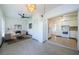 Open-concept living area with a glimpse of a charming kitchen and cozy seating at 4154 57Th N St # 173, Kenneth City, FL 33709