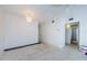 Bright living room features decorative chandelier, neutral walls, and terrazzo flooring at 4154 57Th N St # 173, Kenneth City, FL 33709