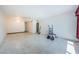 Spacious living room featuring unique terrazzo flooring and ample natural light at 4154 57Th N St # 173, Kenneth City, FL 33709