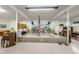 The stage features an American flag, tables and chairs, set, and piano at 4154 57Th N St # 173, Kenneth City, FL 33709
