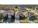 This aerial view showcases a desirable neighborhood setting, highlighting the home's position at 4506 Mapletree Loop, Wesley Chapel, FL 33544