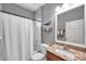 Bathroom featuring a shower-tub combo, granite countertops, and modern fixtures at 4506 Mapletree Loop, Wesley Chapel, FL 33544