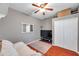 This bedroom offers hardwood floors, natural light, and a closet at 4506 Mapletree Loop, Wesley Chapel, FL 33544