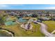 Aerial of neighborhood amenities with playground, tennis courts and pool at 4506 Mapletree Loop, Wesley Chapel, FL 33544