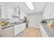 Well-lit kitchen featuring modern stainless-steel appliances, white cabinetry, and granite countertops at 4519 S Hesperides St, Tampa, FL 33611
