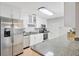 Bright kitchen features stainless steel appliances, granite countertops, and ample white cabinetry at 4519 S Hesperides St, Tampa, FL 33611