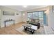 Inviting living room featuring natural light, wood floors, and comfortable furnishings for a relaxing atmosphere at 4519 S Hesperides St, Tampa, FL 33611