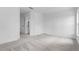 Bedroom with neutral carpet and an adjoining closet and bathroom at 5237 Aberback St, North Port, FL 34291