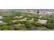 Aerial view of condo building surrounded by lush mangroves, waterways and greenery at 5400 Park N St # 209, St Petersburg, FL 33709