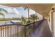 The view from the balcony includes the parking area and palm trees at 5400 Park N St # 209, St Petersburg, FL 33709