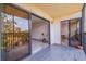 Inviting balcony with tile flooring and views of lush greenery, perfect for outdoor relaxation at 5400 Park N St # 209, St Petersburg, FL 33709