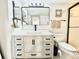 Modern bathroom with a sleek vanity, black hardware, and contemporary design at 5400 Park N St # 209, St Petersburg, FL 33709