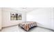Bright bedroom with a neutral color scheme, ceiling fan, and large window at 5400 Park N St # 209, St Petersburg, FL 33709