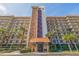 Exterior shot of the building showcasing the brick facade and multiple balconies at 5400 Park N St # 209, St Petersburg, FL 33709