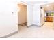 Hallway area featuring washer and dryer unit near the kitchen at 5400 Park N St # 209, St Petersburg, FL 33709