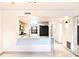Open floor plan kitchen featuring modern countertops, fixtures, and appliances with bright, tile flooring at 5400 Park N St # 209, St Petersburg, FL 33709