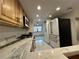 Well-lit kitchen featuring wood cabinets, stainless steel appliances, and granite countertops at 5400 Park N St # 209, St Petersburg, FL 33709
