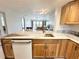 Open concept kitchen with granite counters, stainless steel appliances, and a view to the living room at 5400 Park N St # 209, St Petersburg, FL 33709