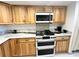 Modern kitchen featuring light wood cabinets, marble countertops, and a double oven range at 5400 Park N St # 209, St Petersburg, FL 33709
