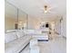 Spacious living area with modern fixtures, tile flooring, and ample natural light at 5400 Park N St # 209, St Petersburg, FL 33709