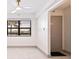 Bright living room with large window with modern tile floors and fresh paint at 5400 Park N St # 209, St Petersburg, FL 33709