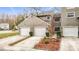 Charming multi-unit home with well-maintained landscaping, white garage doors, and a neutral exterior color at 5832 Red Cedar Ln, Tampa, FL 33625