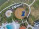 Aerial view of the playground and splashpad, part of the community's recreational amenities at 6216 Kevesta Ave, Palmetto, FL 34221