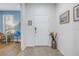 Welcoming foyer with tile flooring, featuring neutral decor, ample lighting, and convenient access to interior spaces at 6216 Kevesta Ave, Palmetto, FL 34221
