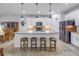 Bright kitchen featuring a large island with pendant lighting, stainless steel appliances, and modern finishes at 6216 Kevesta Ave, Palmetto, FL 34221