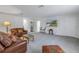 Spacious living room area features a comfortable seating arrangement and large entertainment center at 6216 Kevesta Ave, Palmetto, FL 34221