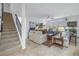 Spacious living area features an open staircase and a comfortable seating arrangement, complete with a ceiling fan at 6216 Kevesta Ave, Palmetto, FL 34221