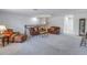 Large upstairs living room area features soft carpet, a high ceiling, and nice furniture at 6216 Kevesta Ave, Palmetto, FL 34221