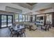 Community lounge area with modern furniture, large windows, and a view of the swimming pool at 6216 Kevesta Ave, Palmetto, FL 34221