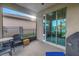 Covered patio with ample seating and sliding glass doors leading into the home at 6216 Kevesta Ave, Palmetto, FL 34221