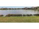 Beautiful pond view from the backyard features a well-maintained lawn at 6216 Kevesta Ave, Palmetto, FL 34221