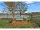 Bench overlooking the pond surrounded by lush landscaping offers a relaxing space at 6216 Kevesta Ave, Palmetto, FL 34221