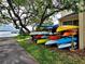 Canoe rack near the lake with a variety of colorful canoes, perfect for outdoor recreation at 90 S Highland Ave # 423, Tarpon Springs, FL 34689