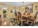 Elegant dining room featuring a decorative rug, unique light fixture, and ornate chairs at 90 S Highland Ave # 423, Tarpon Springs, FL 34689