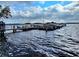 A dock featuring boats on the water, with a view of the horizon at 90 S Highland Ave # 423, Tarpon Springs, FL 34689