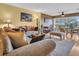 Bright living room with comfortable seating and a view of the outdoor balcony at 90 S Highland Ave # 423, Tarpon Springs, FL 34689