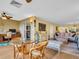 Open-concept living room and dining area with natural light and stylish decor at 90 S Highland Ave # 423, Tarpon Springs, FL 34689