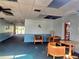 A lobby with lounge seating, a table, and an entrance to the library area at 90 S Highland Ave # 423, Tarpon Springs, FL 34689