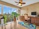 Home office with large window, desk, and plants with lots of natural light at 90 S Highland Ave # 423, Tarpon Springs, FL 34689