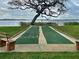 Community shuffleboard court with lake view, perfect for outdoor activities at 90 S Highland Ave # 423, Tarpon Springs, FL 34689