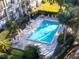 A pristine swimming pool is surrounded by lush landscaping, providing a private oasis for relaxation and recreation at 90 S Highland Ave # 423, Tarpon Springs, FL 34689