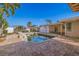 Backyard with a pool and stone waterfall feature at 911 Boca Ciega Isle Dr, St Pete Beach, FL 33706