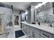 Elegant bathroom featuring marble accents, double vanity, and spacious walk-in closet at 204 Latitude Pl, Apollo Beach, FL 33572