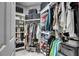 Spacious walk-in closet with custom shelving and ample storage for clothes and accessories at 204 Latitude Pl, Apollo Beach, FL 33572